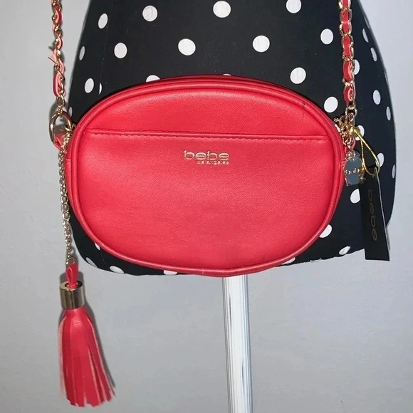bebe Handbags - bebe - NWT Adorable Red All Over Cross Body Clutch